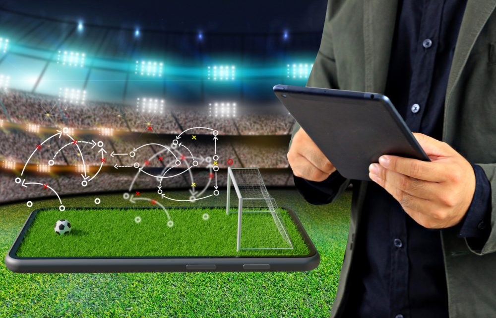 football-manager-with-game-strategy-smartphone-soccer-field